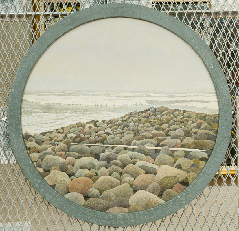 Round painting of rocks on a beach.