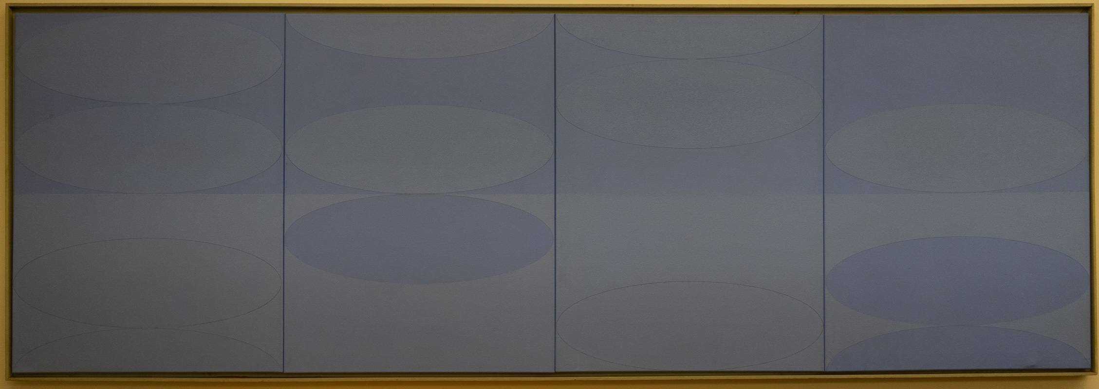 A bluehorizontal canvas, divided into two rows of four, with various ovals inset into most of the subdivisions.