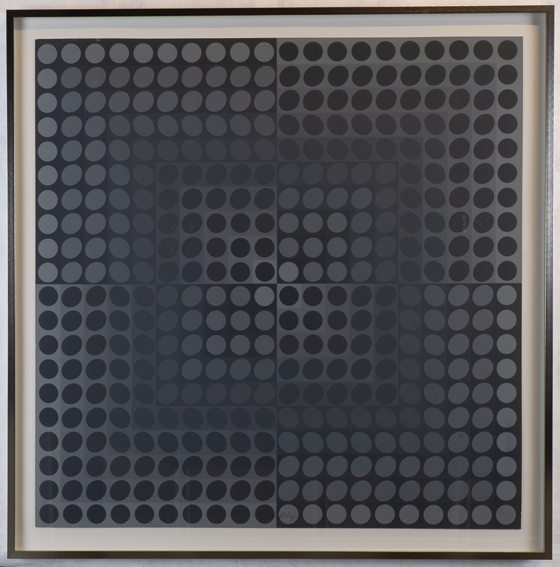 A square print in dark greys and blacks consisting of regular small circles and ovals. The composition gives the appearance of fluidity and movement.