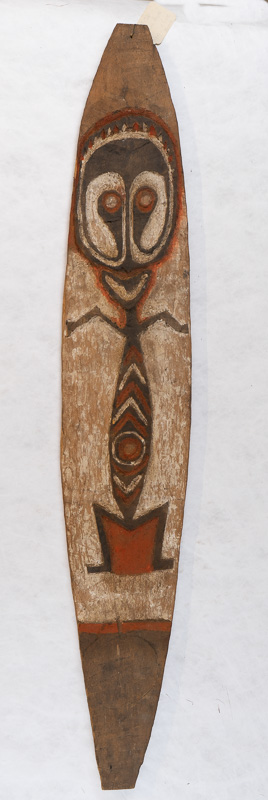 Tall skinny wooden board with stylized figure.